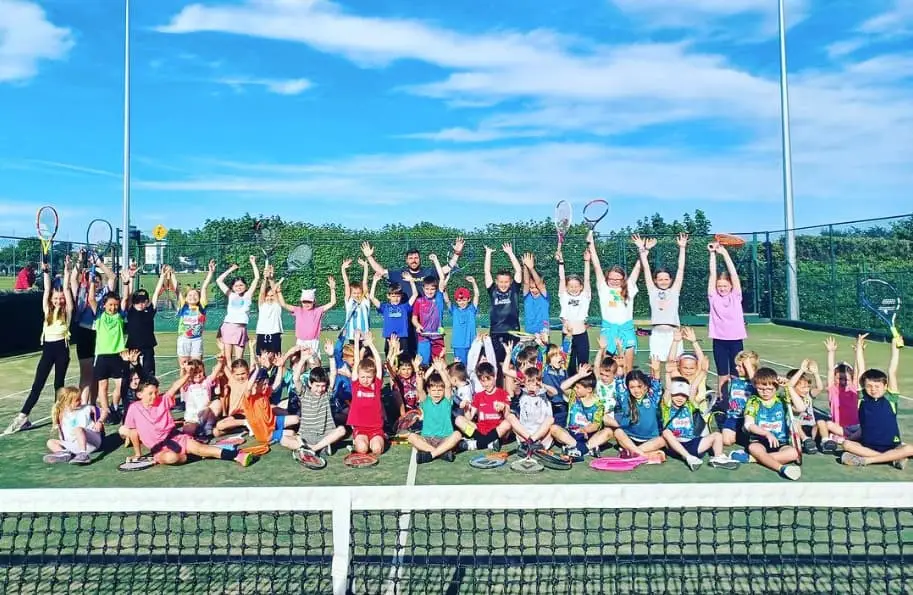 children on the tennis court