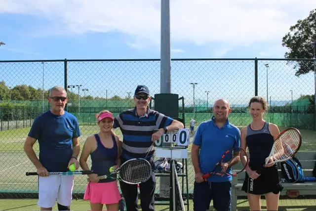 Men and Women playing tennis
